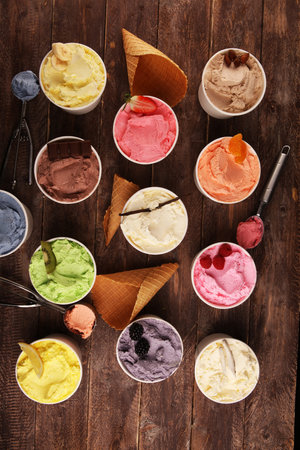 Various of ice cream flavor with fresh blueberry, strawberry, kiwi, lemon, vanilla setup on rustic...