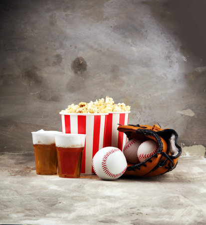 Popcorn on the table with draft beer. Baseball party food の写真素材