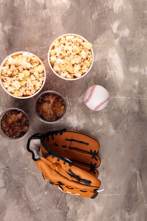 Popcorn on the table with cola softdrink. Baseball party food 