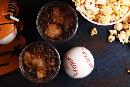 Popcorn on the table with cola softdrink. Baseball party food の写真素材