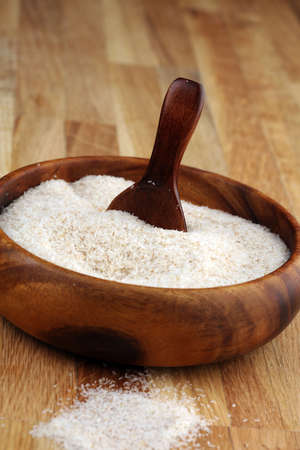 Portion of Psyllium Seeds on rustic background. Psyllium seed husks on woodenの写真素材