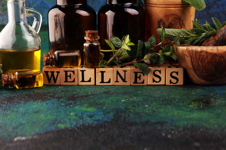 Homegrown and aromatic herbs.Set of culinary herbs. Green growing sage, oregano, thyme, basil, mint and oregano. Wellness sign with wooden cubesの写真素材