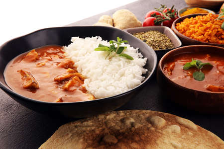 Chicken tikka masala spicy curry meat food in pot with rice and naan bread. indian food with chicken and curryの写真素材