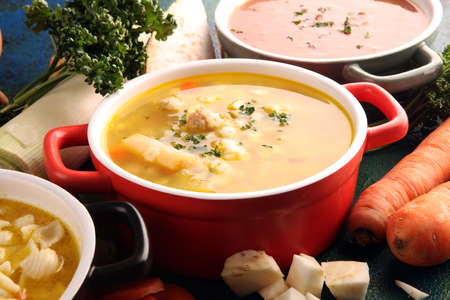 Set of three soups from worldwide cuisines, healthy food. Broth with noodles, beef soup and broth with marrow dumplings. All soups with healthy vegetables.の写真素材