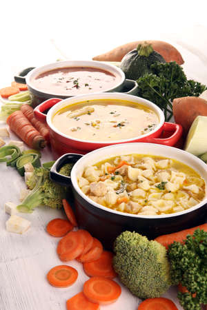 Set of three soups from worldwide cuisines, healthy food. Broth with noodles, beef soup and broth with marrow dumplings. All soups with healthy vegetables.の写真素材