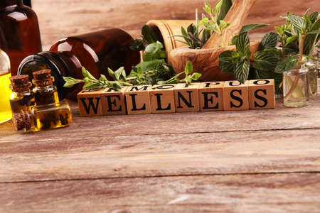 Homegrown and aromatic herbs.Set of culinary herbs. Green growing sage, oregano, thyme, basil, mint and oregano. Wellness sign with wooden cubesの写真素材