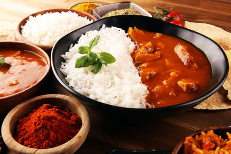 Chicken tikka masala spicy curry meat food in pot with rice and naan bread. indian food with chicken and curryの写真素材