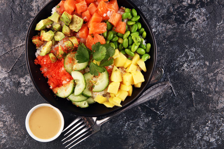 buddha bowl with salmon and avocado with organic vegetables