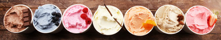 Various of ice cream flavor with fresh blueberry, strawberry, raspberry, chocolate, vanilla setup on rustic background . Summer and Sweet ice creamの写真素材