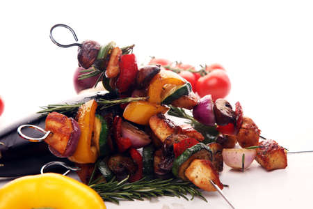 Grilled pork shish or kebab on skewers with vegetables . Food background shashlik or chicken skewersの写真素材