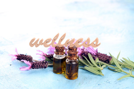lavender herbal oil and lavender flowers. bottle of lavender massage oil for aromatherapy beauty...