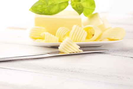 butter swirls. margarine or spread, fatty natural dairy product. High-calorie food for cooking and...