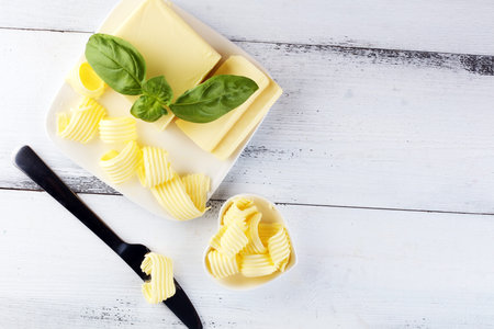 butter swirls. margarine or spread, fatty natural dairy product. High-calorie food for cooking and...