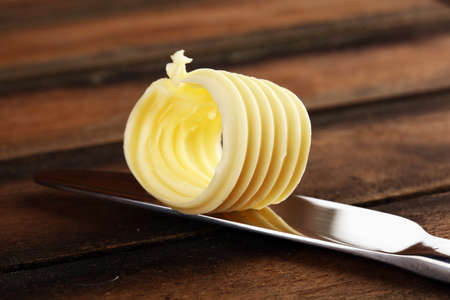 butter swirls. margarine or spread, fatty natural dairy product. High-calorie food for cooking and eatingの写真素材