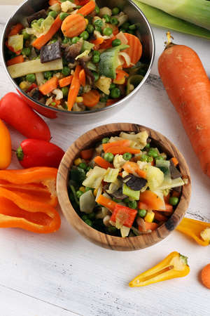 stir fried vegetables from a chinese wok in a bowl with carrotの写真素材