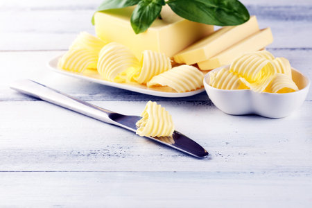 butter swirls. margarine or spread, fatty natural dairy product. High-calorie food for cooking and eatingの写真素材
