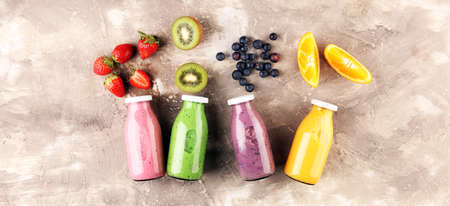 Smoothie variation. Healthy lifestyle concept. several bottles with fruit and berry juices smoothies and milkshakesの写真素材