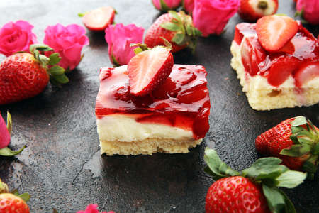 strawberry cake and many fresh strawberries with hearts and roses for valentines dayの写真素材
