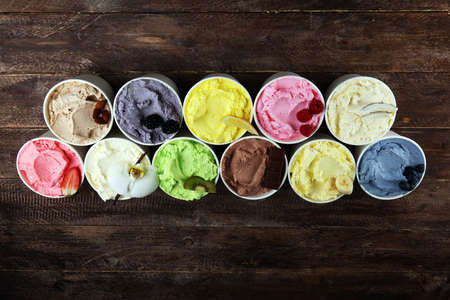 Various of ice cream flavor with fresh blueberry, strawberry, kiwi, lemon, vanilla setup on rustic background . Summer and Sweet ice creamの写真素材