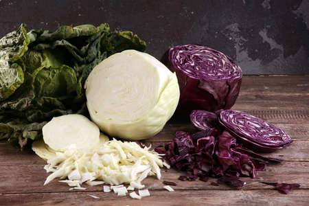 Three fresh organic cabbage heads. Antioxidant balanced diet eating with red cabbage, white cabbage and fresh savoyの写真素材