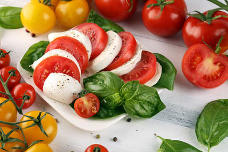 Mozzarella. Traditional italian food - white ball mozzarella buffalo Italian soft cheese with tomato, basil, olive oilの写真素材