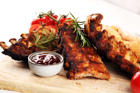 Grilled spare ribs for a tasty bbq meat with spicy barbecue sauceの写真素材