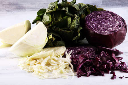 Three fresh organic cabbage heads. Antioxidant balanced diet eating with red cabbage, white cabbage and fresh savoyの写真素材