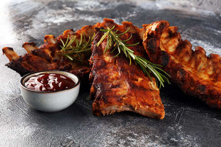 Grilled spare ribs for a tasty bbq meat with spicy barbecue sauceの写真素材
