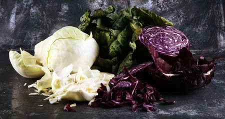 Three fresh organic cabbage heads. Antioxidant balanced diet eating with red cabbage, white cabbage and fresh savoyの写真素材