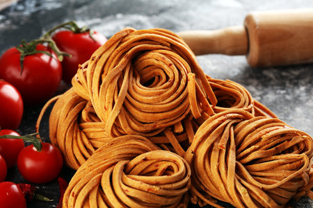 Closeup of raw fresh homemade chili pasta. fresh italian traditional raw pastaの写真素材