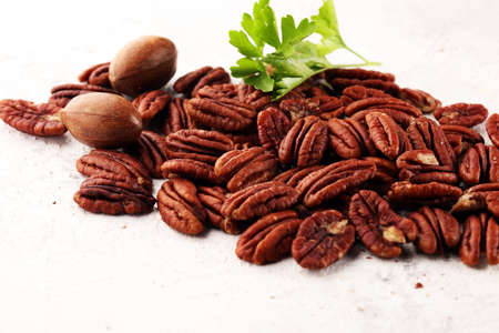 Fresh Pecan nuts on a rustic table.の写真素材