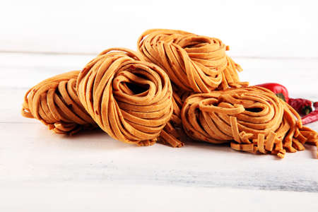 Closeup of raw fresh homemade pasta. fresh italian traditional raw pastaの写真素材