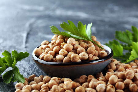 Raw Chickpeas in a bowl. Chickpeas is nutritious food. Healthy and natural vegetarian foodの写真素材
