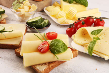 canape with yellow cheese and tomato. bread or toast with cheese for breakfastの写真素材