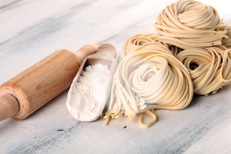Closeup of raw fresh homemade pasta. fresh italian traditional raw pastaの写真素材