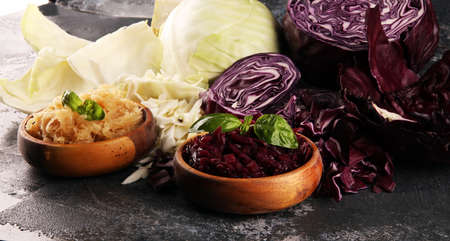 pickled red and fermented white cabbage and Chopped fresh cabbage. Prepare sliced vegetable for cooking cabbage salad or coleslaw. Homemade fresh food concept.の写真素材