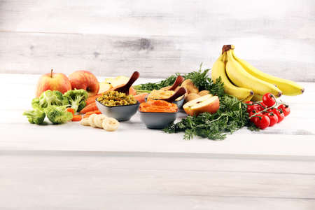 Bowls with baby food. Green, yellow and orange baby puree with fresh organic vegetablesの写真素材