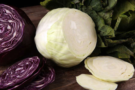 Three fresh organic cabbage heads. Antioxidant balanced diet eating with red cabbage, white cabbage and fresh savoyの写真素材