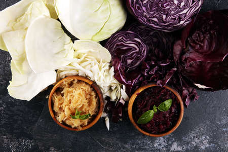 pickled red and fermented white cabbage and Chopped fresh cabbage. Prepare sliced vegetable for cooking cabbage salad or coleslaw. Homemade fresh food concept.の写真素材