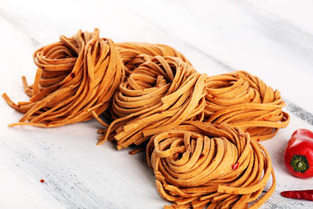 Closeup of raw fresh homemade pasta. fresh italian traditional raw pastaの写真素材