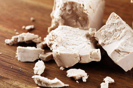 Dry yeast crumbled and yeast cube block for baking.の写真素材
