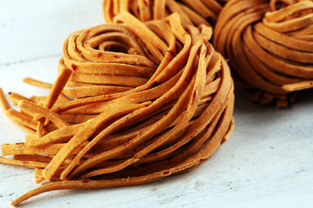 Closeup of raw fresh homemade pasta. fresh italian traditional raw pastaの写真素材