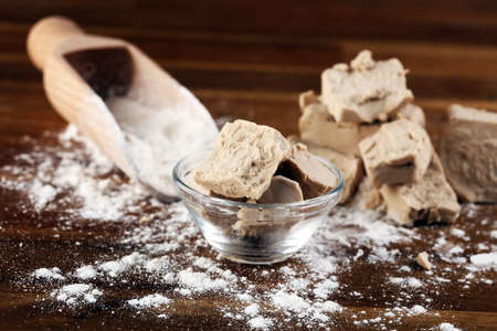 Dry yeast crumbled and yeast cube block for baking.の写真素材