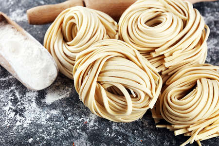 Closeup of raw fresh homemade pasta. fresh italian traditional raw pastaの写真素材