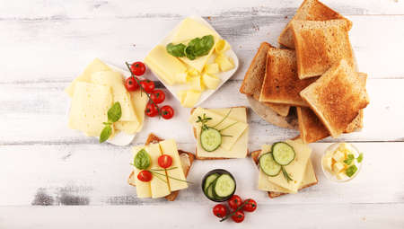 canape with yellow cheese and tomato. bread or toast with cheese for breakfastの写真素材