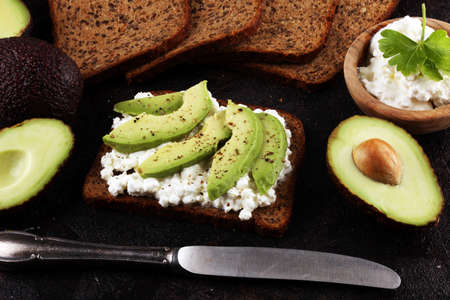 Sandwich with avocado and 
grained cream cheese for a healthy breakfast conceptの写真素材