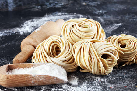 Closeup of raw fresh homemade pasta. fresh italian traditional raw pastaの写真素材