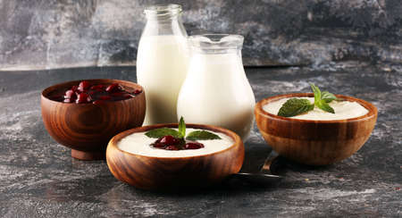 Rice porridge or milk rice pudding with syrup in a vintage bowl for a tasty breakfast.の写真素材