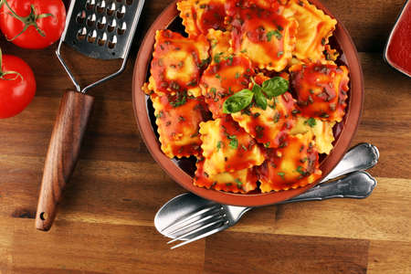 Ravioli with tomato sauce and basil. Homemade italian ravioli for dinnerの写真素材