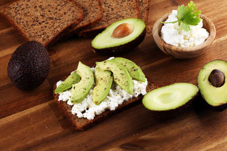 Sandwich with avocado and 
grained cream cheese for a healthy breakfast conceptの写真素材
